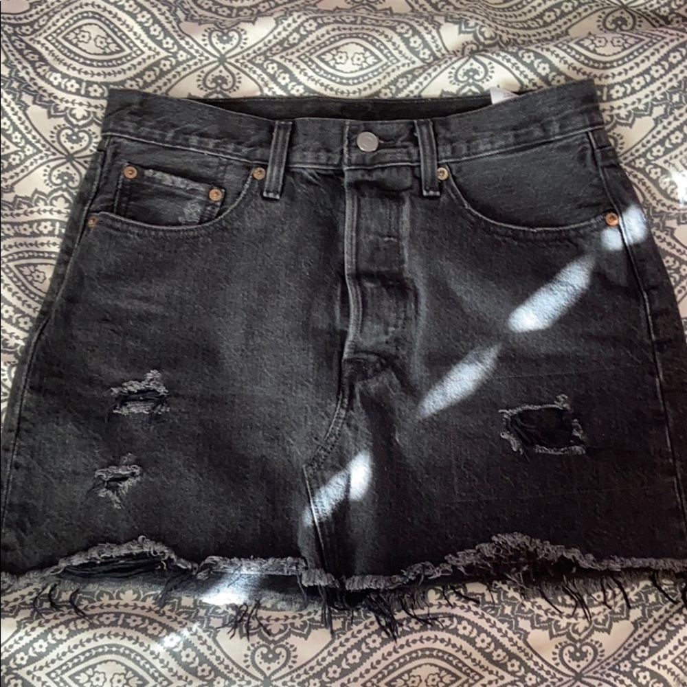 Levi’s high rise distressed black denim skirt